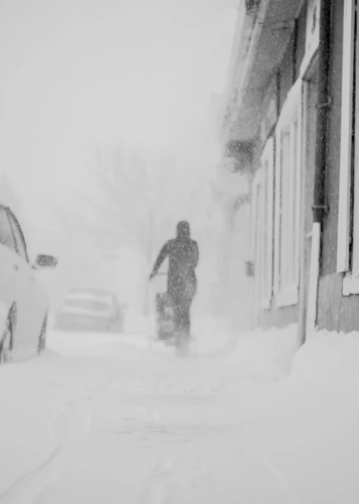 A man walking down a snow covered street