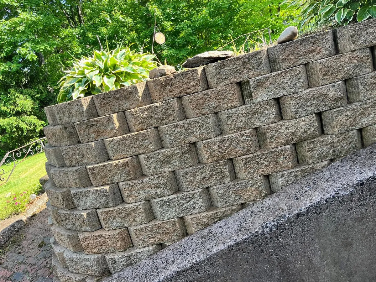 A woman standing near a painting in a modern art gallery
