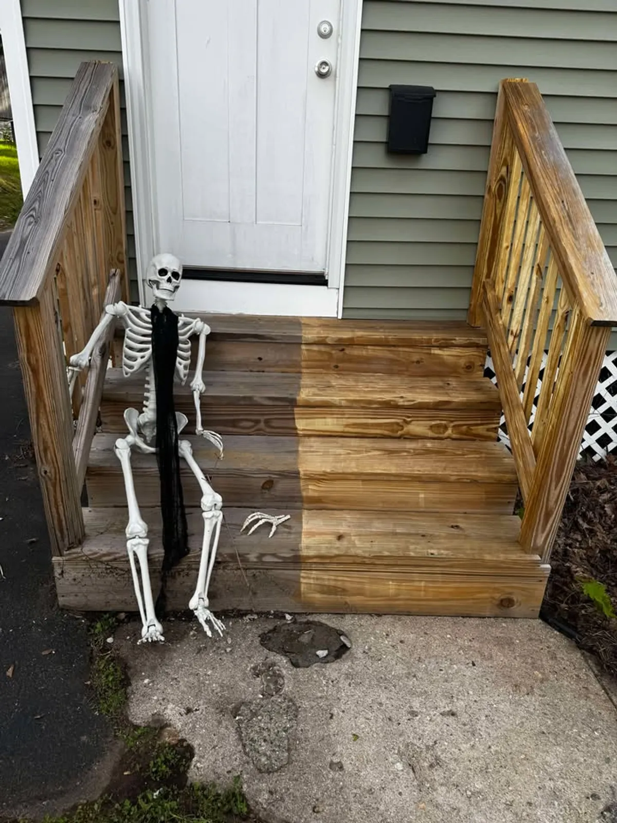 man sitting near museum painting
